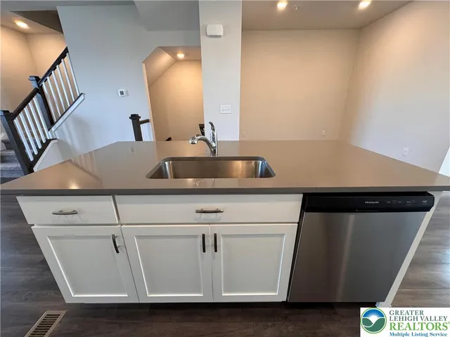 a sink with a washer and dryer