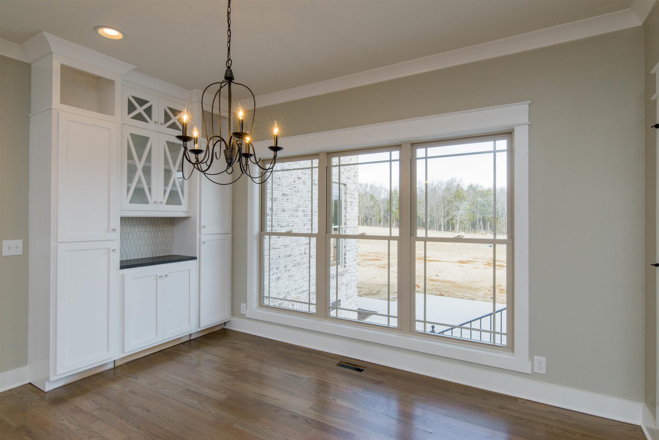 6988 Williams Road Christiana, TN 37037 - Photo 14 of 30 This eat in kitchen area features triple window that looks out into backyard and wooded area. Custom cabinetry in this area for more storage.