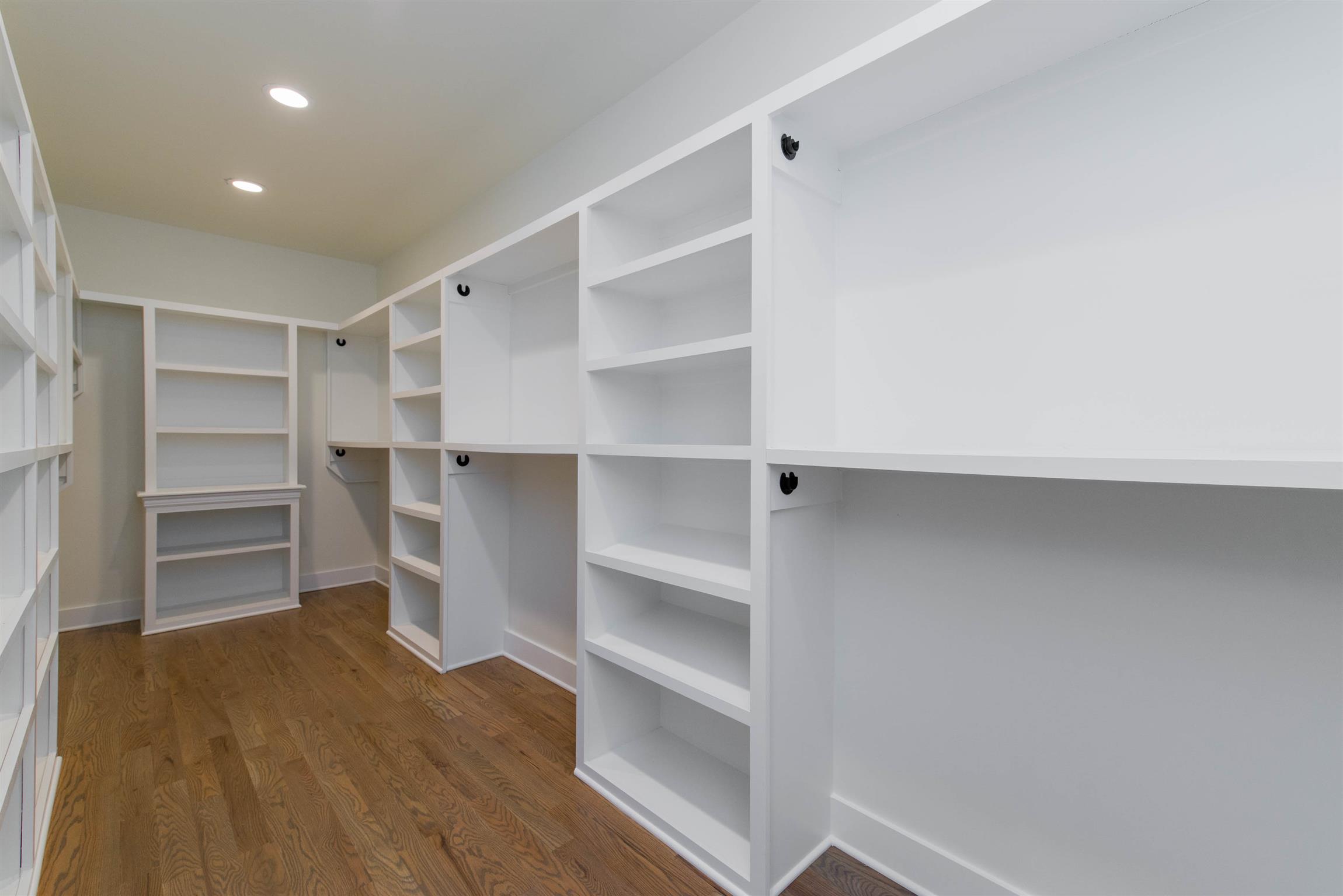 6988 Williams Road Christiana, TN 37037 - Photo 20 of 30 WOW! AMAZING MASTER CLOSET. This closet features hardwood flooring and custom built in shelving. Recessed lighting.
