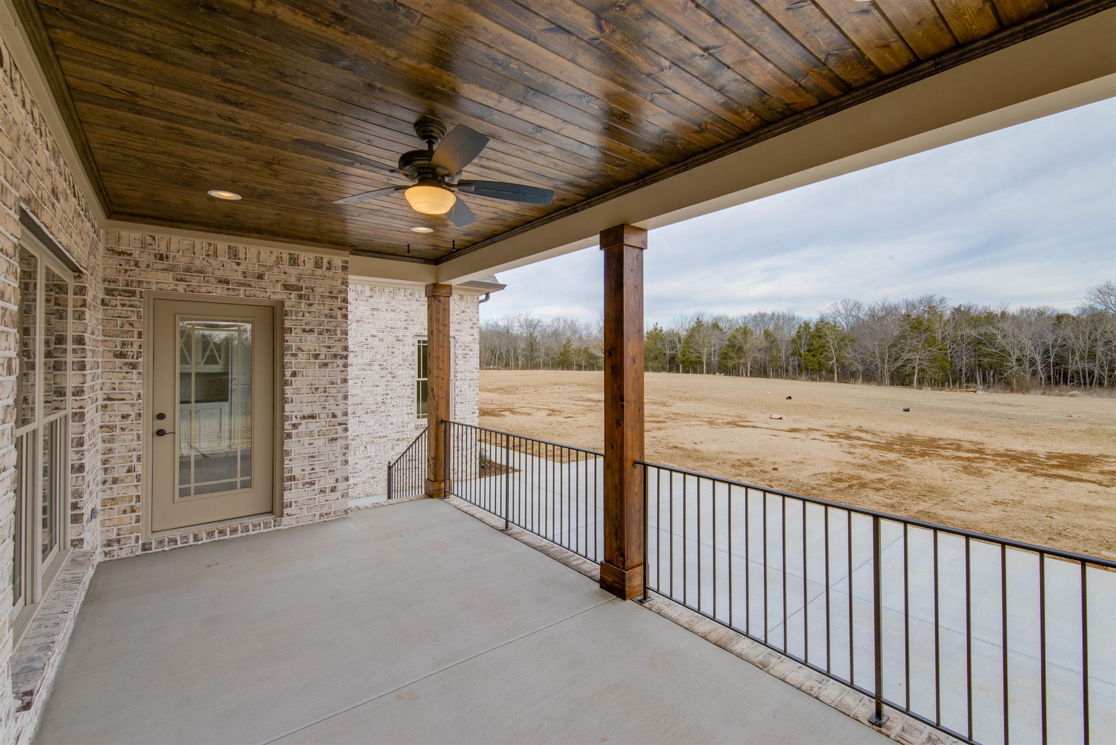 6988 Williams Road Christiana, TN 37037 - Photo 3 of 30 View from back porch. All porches feature stained tongue and groove cielings. Custom railings. OVERSIZED PATIO with sidewalk that leads to turnaround.