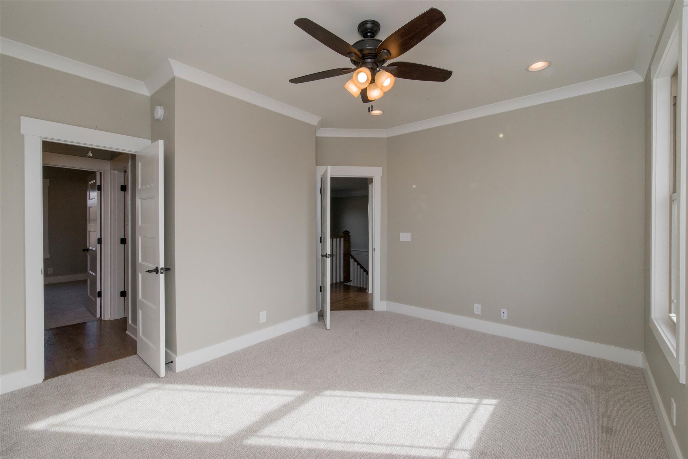6988 Williams Road Christiana, TN 37037 - Photo 26 of 30 Front bedroom with walk in closet and custom shelving. This bedroom shares bathroom with back bedroom.