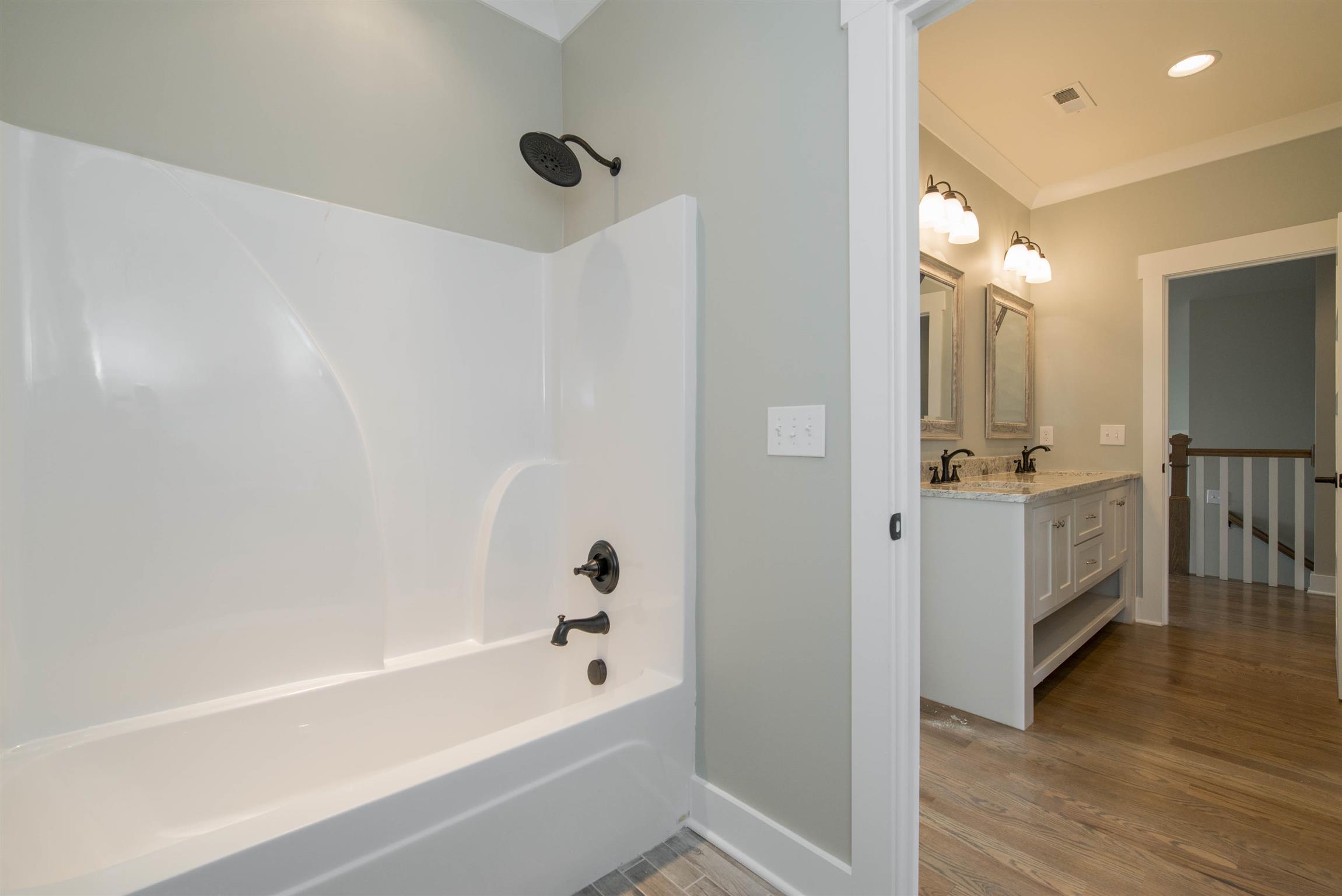 6988 Williams Road Christiana, TN 37037 - Photo 28 of 30 View from toilet/tub and shower room looking into double vanity area shared by jack and jill bedrooms.