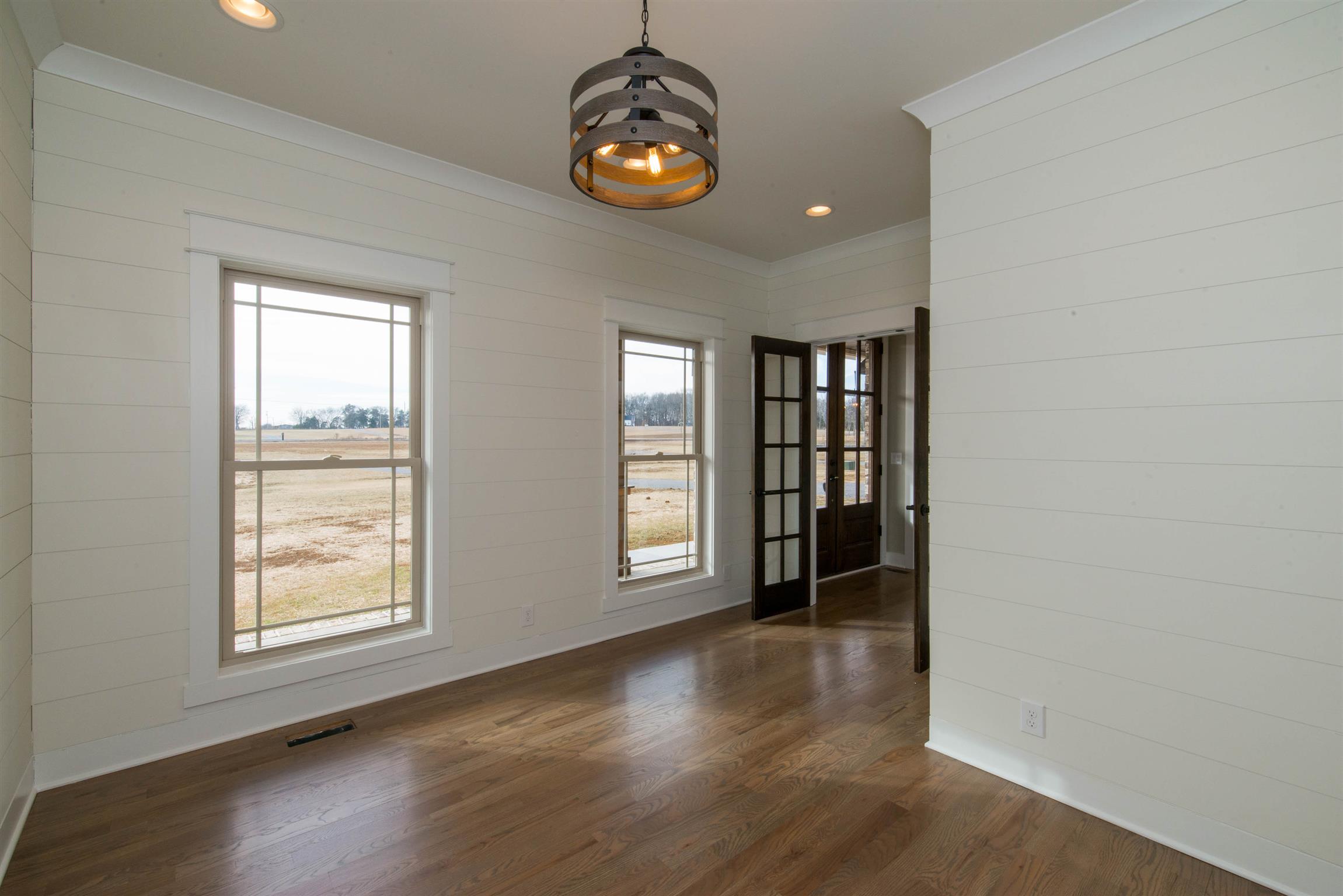 6988 Williams Road Christiana, TN 37037 - Photo 8 of 30 View of office right off the foyer. Stained double doors lead into this shiplap office and custom light fixture.