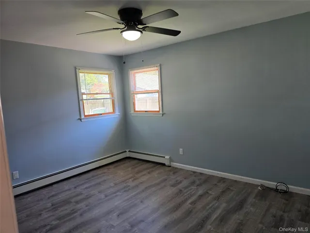 a bathroom with a sink vanity granite and a mirror