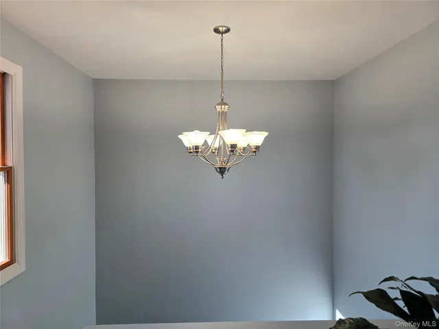 a bathroom with a mirror and a shower