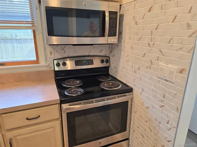 a close view of stove and microwave
