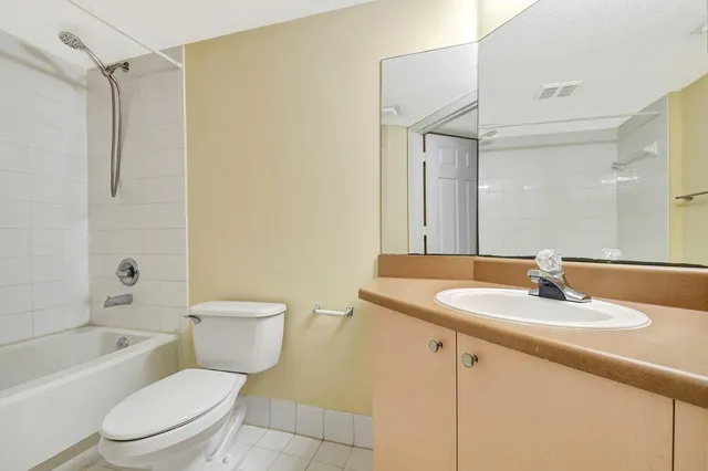 a bathroom with a shower and a bath tub