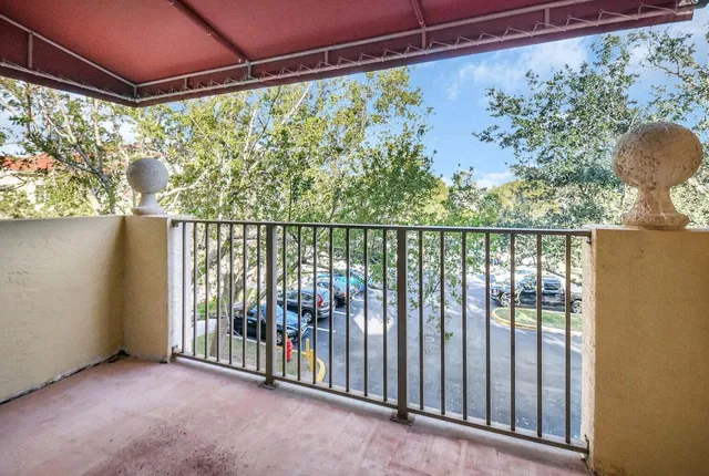 a view of a porch with wooden floor and outdoor space