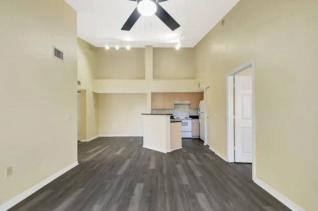 a view of a kitchen with wooden floor