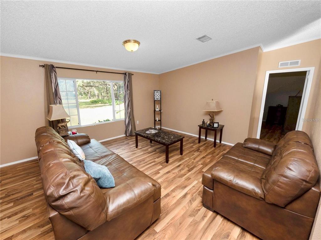 3201 Tenoroc Mine Road Lakeland, FL 33805 - Photo 11 of 48 a living room with furniture and a large window