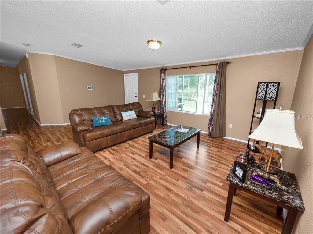 3201 Tenoroc Mine Road Lakeland, FL 33805 - Photo 12 of 48 a living room with furniture and a window