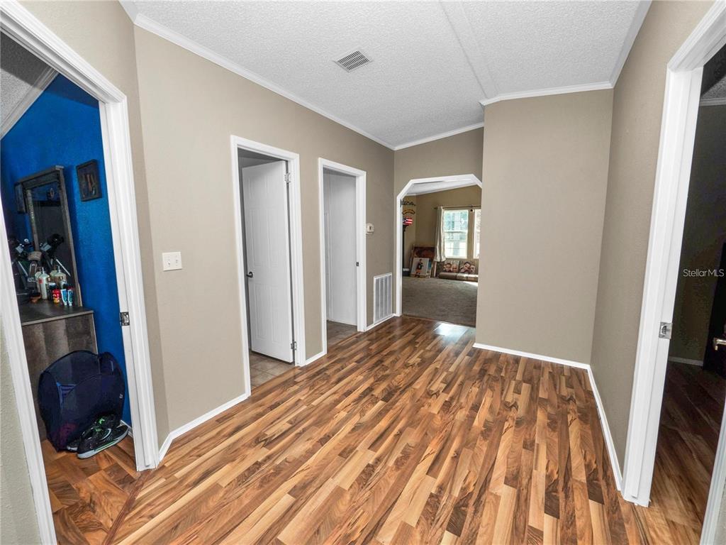 3201 Tenoroc Mine Road Lakeland, FL 33805 - Photo 22 of 48 a view of a livingroom with wooden floor and closet