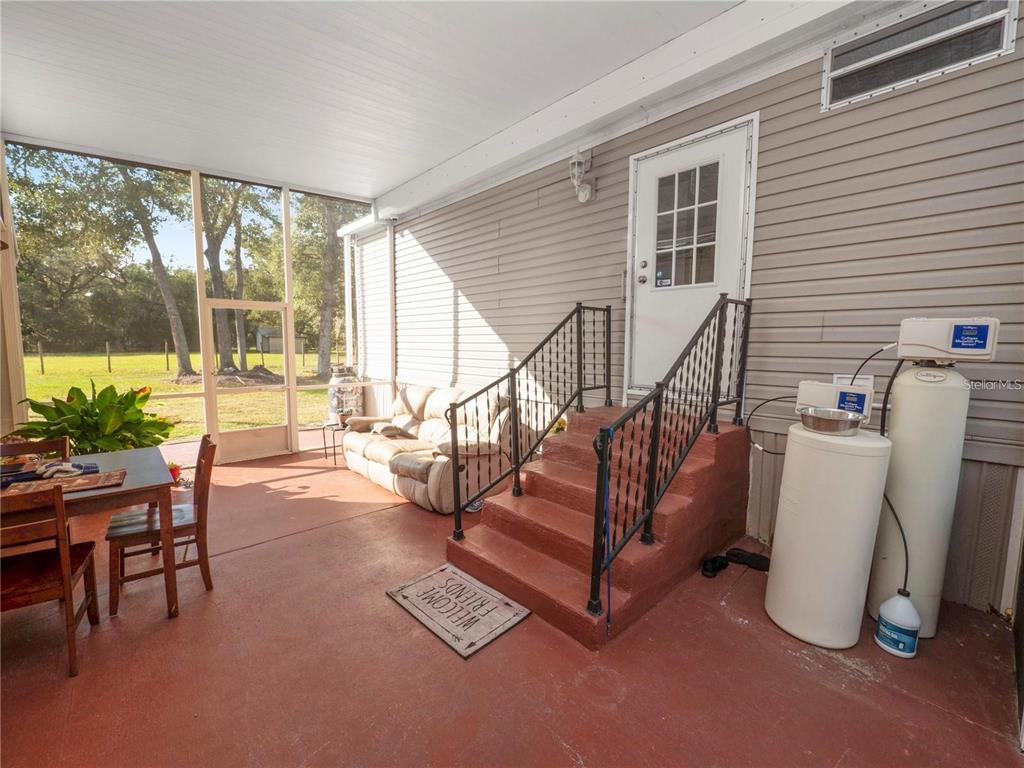 3201 Tenoroc Mine Road Lakeland, FL 33805 - Photo 34 of 48 a view of a livingroom with furniture and floor to ceiling window