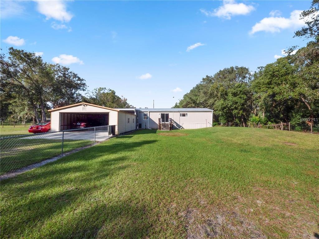 3201 Tenoroc Mine Road Lakeland, FL 33805 - Photo 37 of 48 a front view of a house with a yard