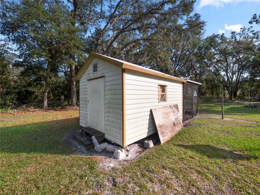 3201 Tenoroc Mine Road Lakeland, FL 33805 - Photo 39 of 48 a view of a house with a yard