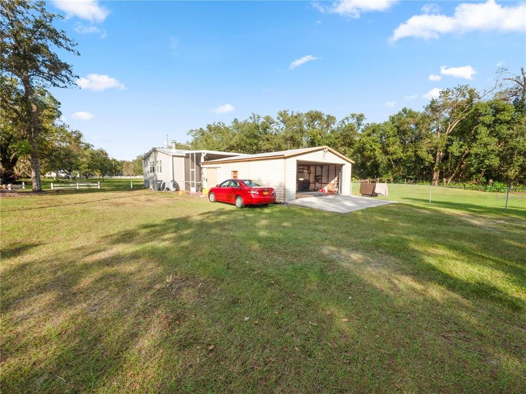 3201 Tenoroc Mine Road Lakeland, FL 33805 - Photo 42 of 48 a view of an house with backyard and entertaining space