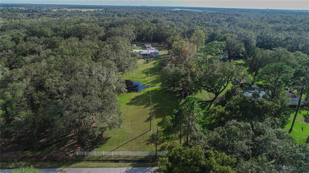 3201 Tenoroc Mine Road Lakeland, FL 33805 - Photo 48 of 48 an aerial view of residential houses with outdoor space and trees
