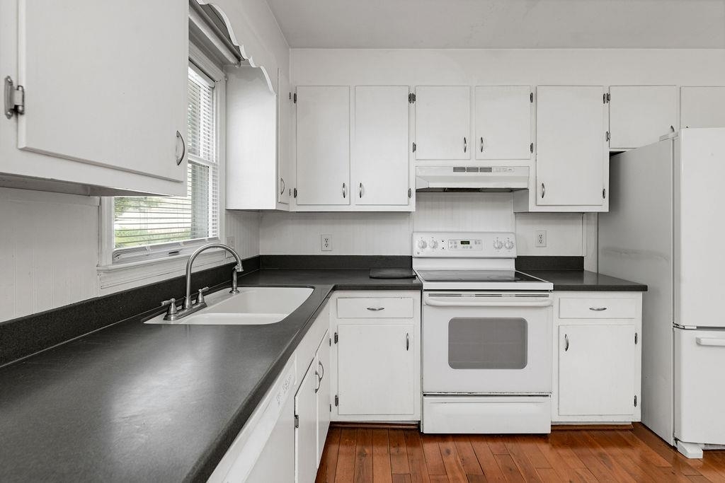 66 Hayrick Road Waynesboro, VA 22980 - Photo 13 of 26 a kitchen with granite countertop a sink a stove and cabinets