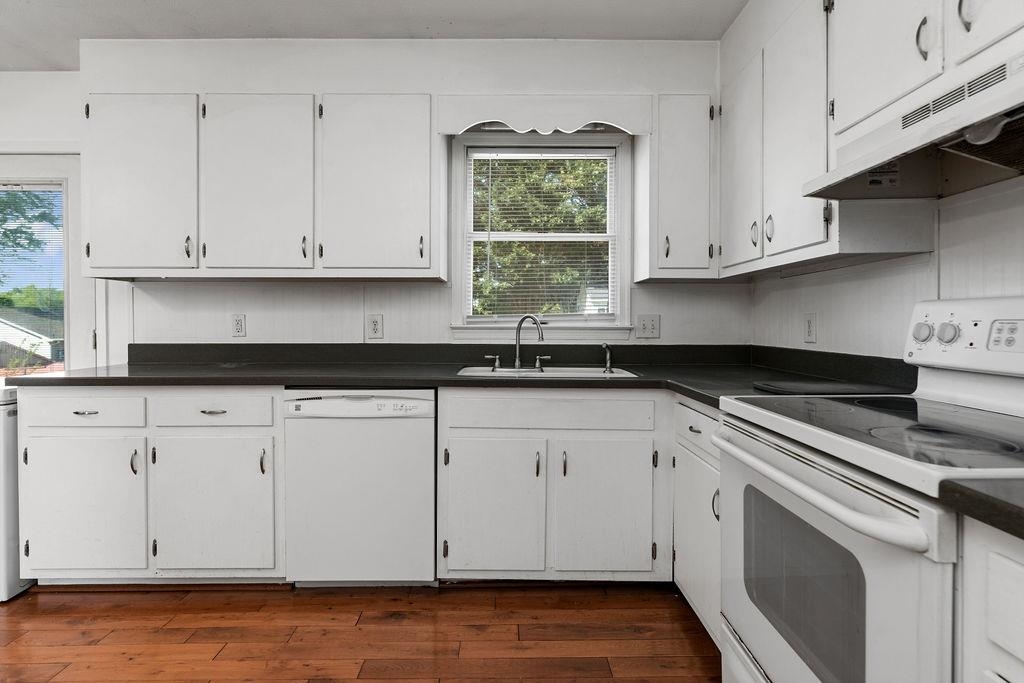 66 Hayrick Road Waynesboro, VA 22980 - Photo 14 of 26 a kitchen with granite countertop white cabinets and a stove