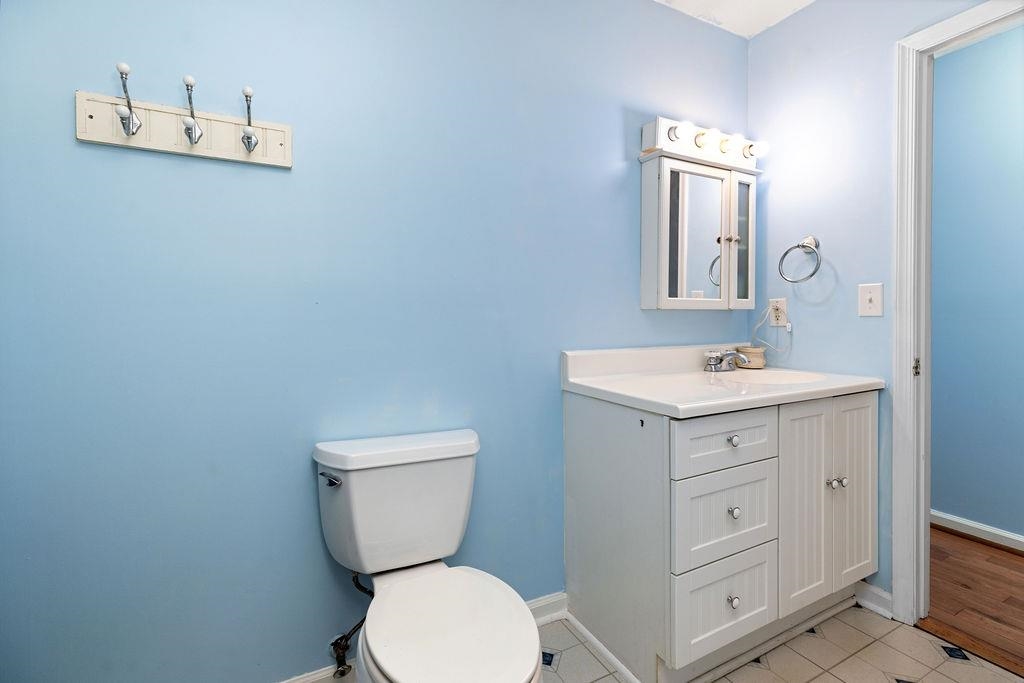 66 Hayrick Road Waynesboro, VA 22980 - Photo 22 of 26 a bathroom with a toilet a sink a mirror and vanity