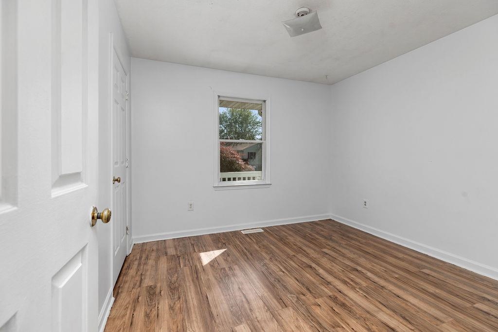 66 Hayrick Road Waynesboro, VA 22980 - Photo 23 of 26 a view of empty room with wooden floor and fan