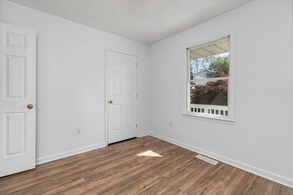 66 Hayrick Road Waynesboro, VA 22980 - Photo 24 of 26 a view of an empty room with wooden floor and a window