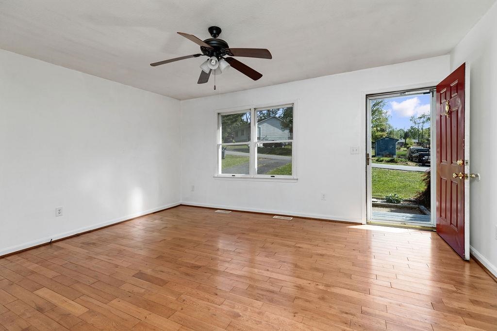 66 Hayrick Road Waynesboro, VA 22980 - Photo 8 of 26 a view of an empty room with wooden floor and a window