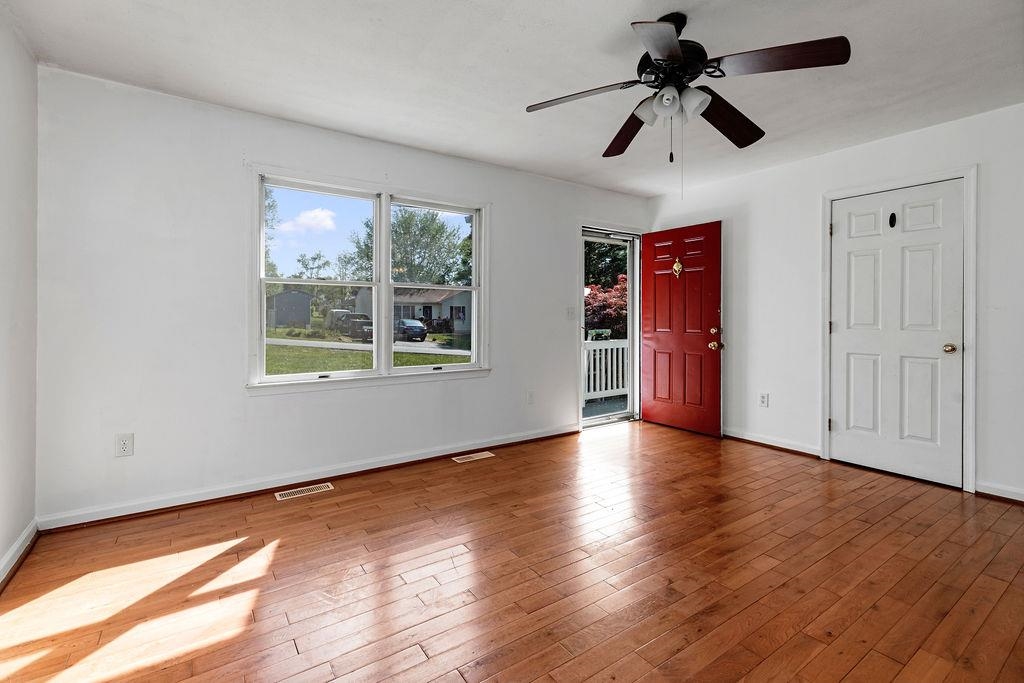 66 Hayrick Road Waynesboro, VA 22980 - Photo 9 of 26 a view of an empty room with window and wooden floor