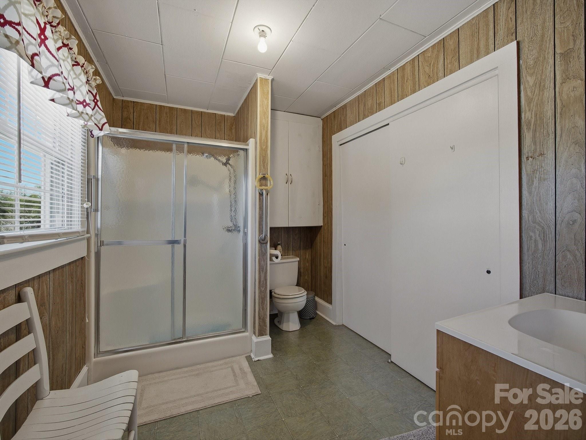 3560 Hartland Road Morganton, NC 28655 - Photo 17 of 27 a bathroom with a granite countertop shower and a sink
