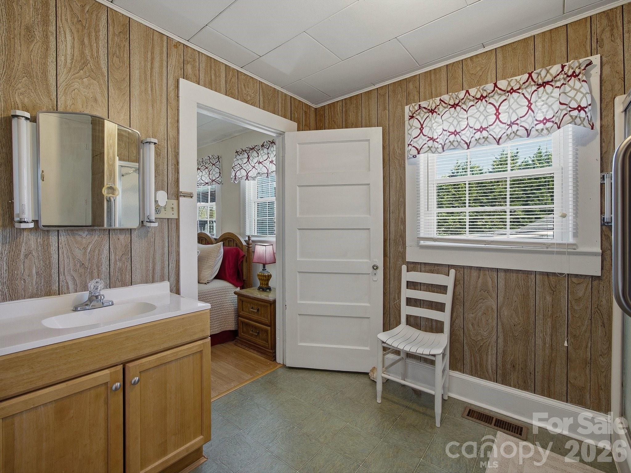 3560 Hartland Road Morganton, NC 28655 - Photo 18 of 27 a bathroom with a sink and a mirror