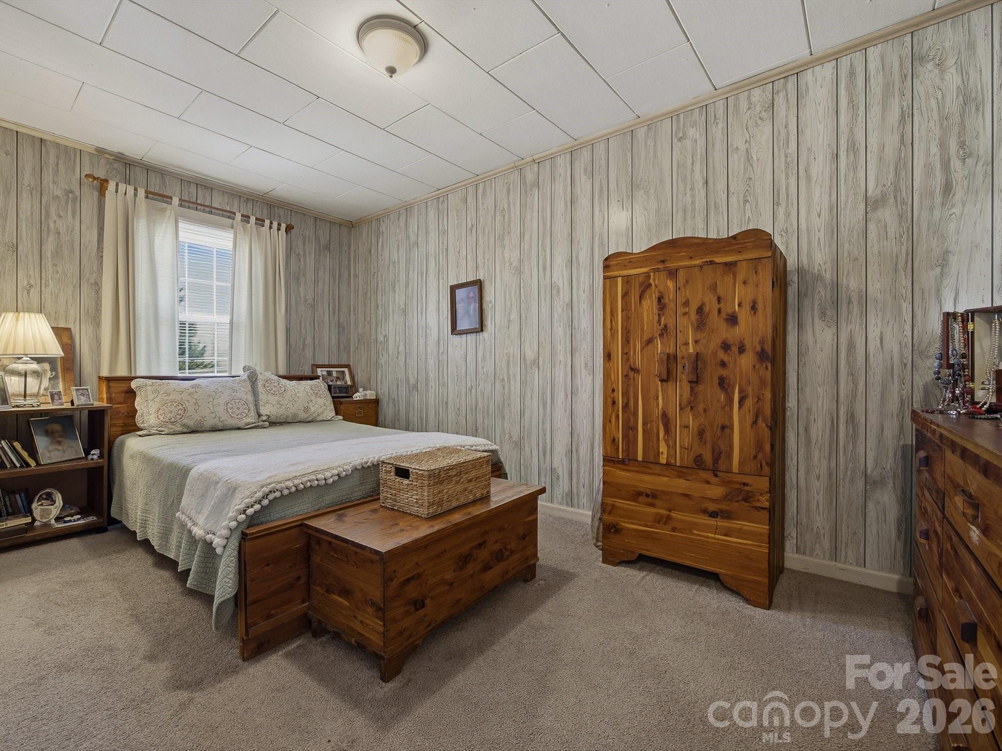3560 Hartland Road Morganton, NC 28655 - Photo 19 of 27 a bedroom with a bed and a table