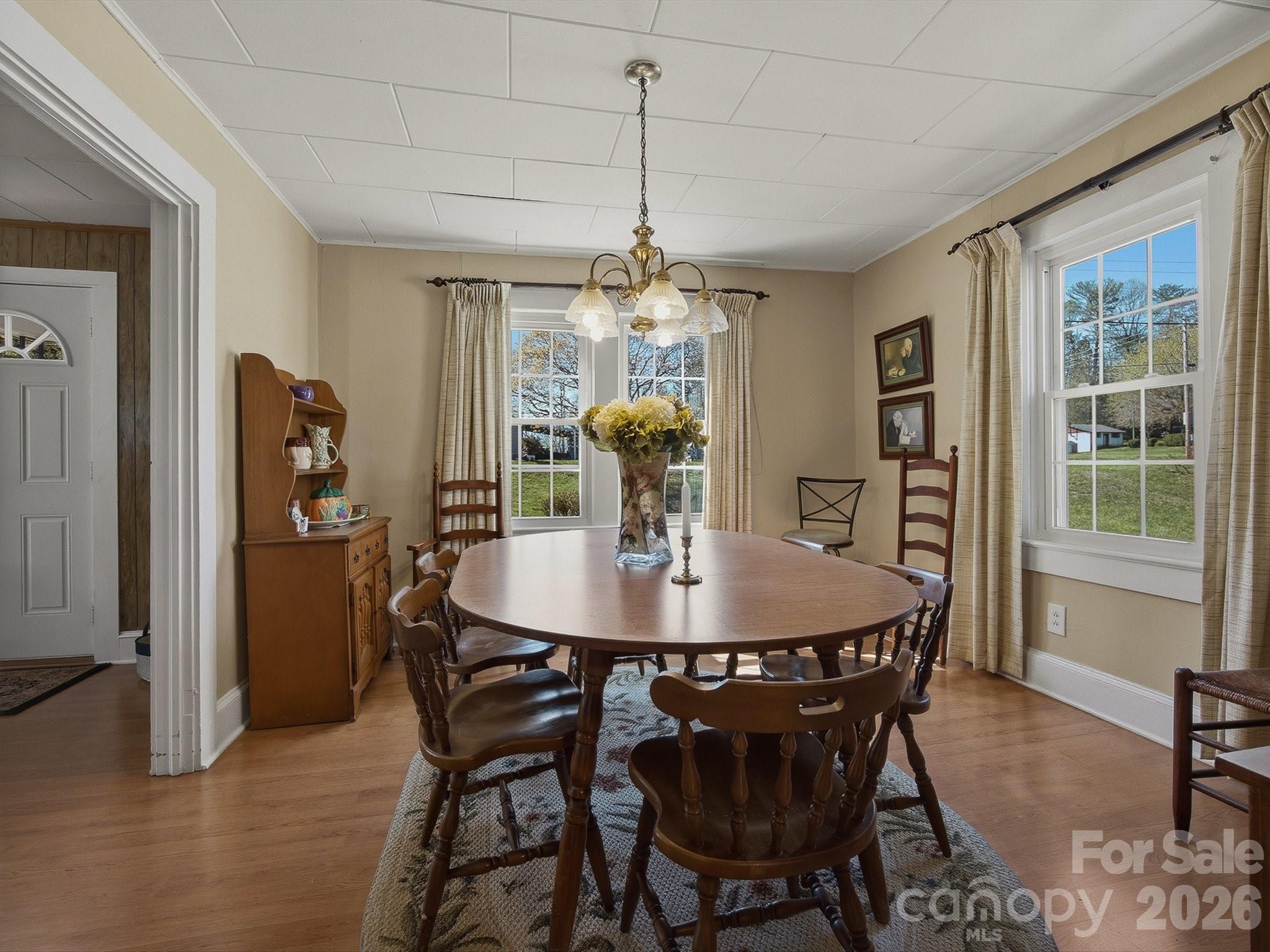 3560 Hartland Road Morganton, NC 28655 - Photo 21 of 27 a view of a dining room with furniture window and wooden floor
