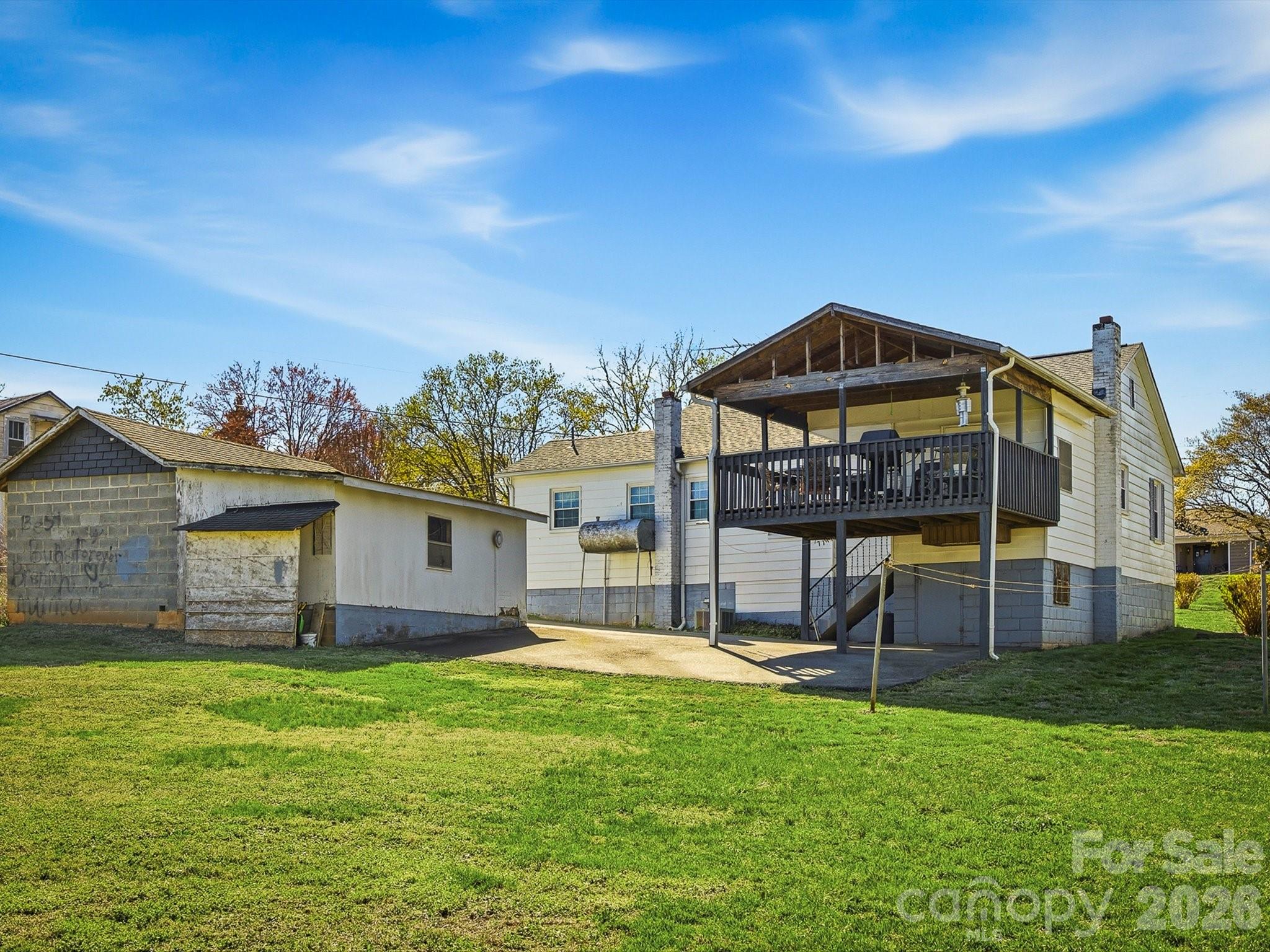 3560 Hartland Road Morganton, NC 28655 - Photo 9 of 27 a front view of a house with a garden