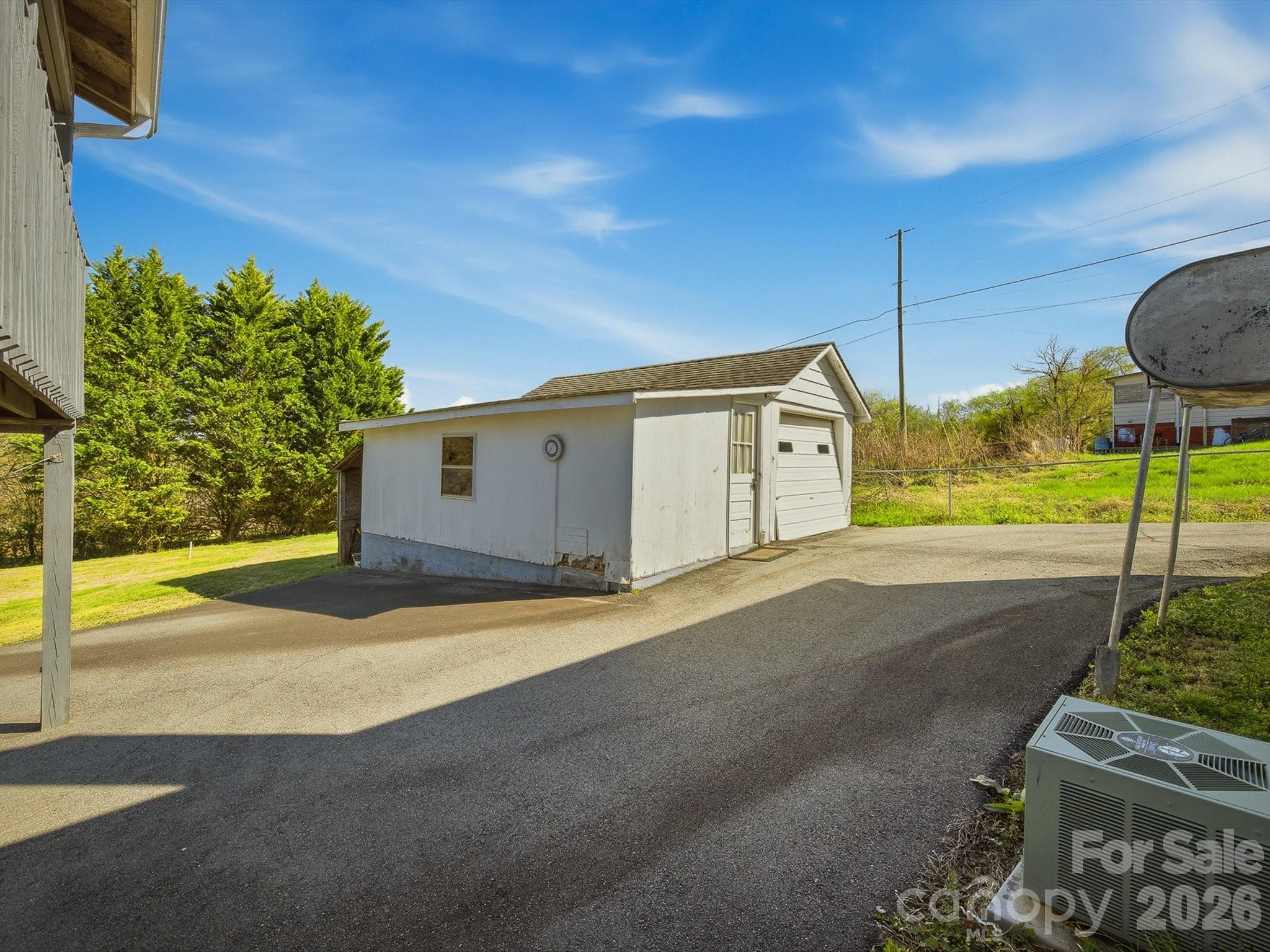 3560 Hartland Road Morganton, NC 28655 - Photo 10 of 27 a backyard of a house with table and chairs