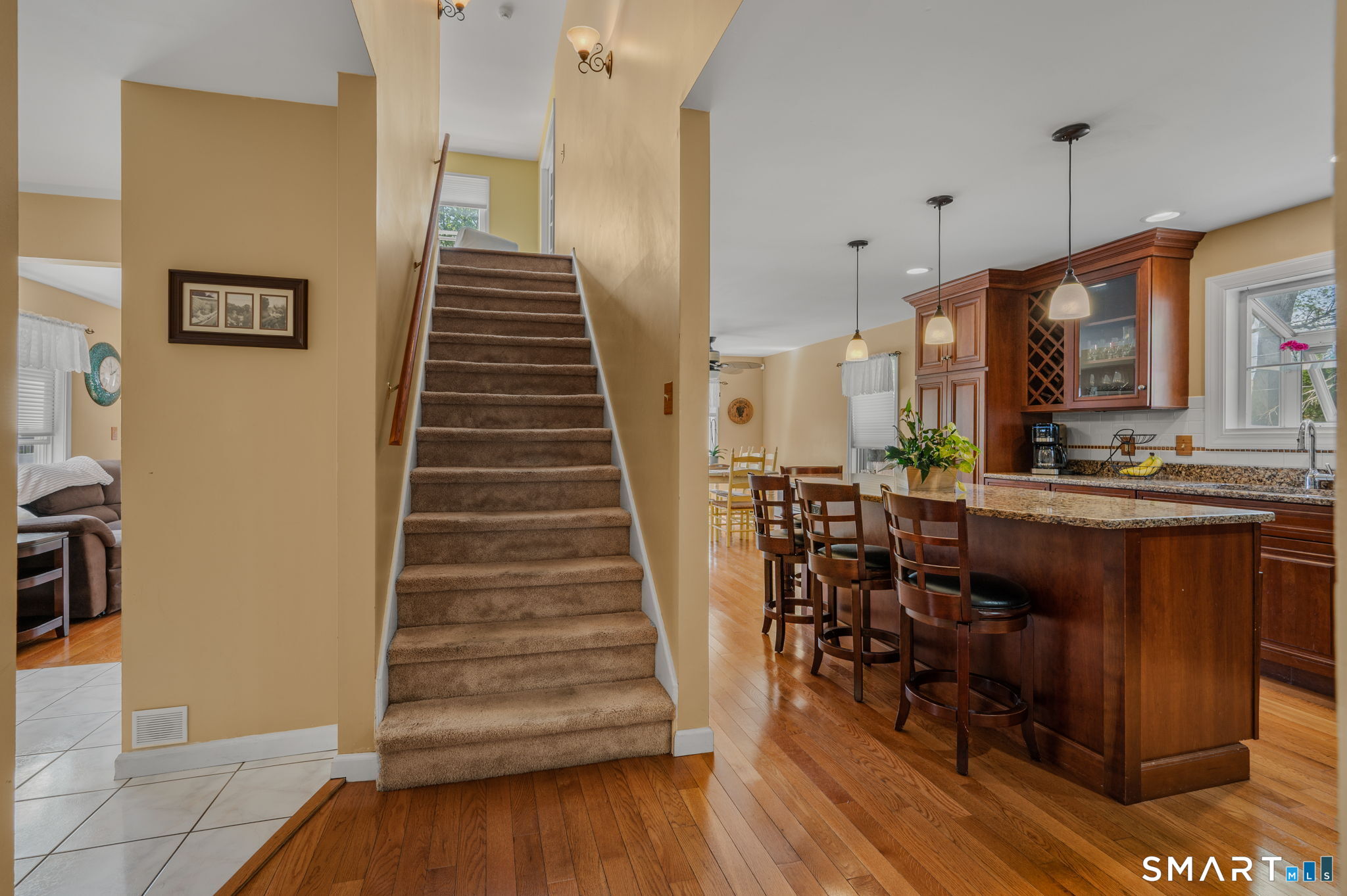 212 R Shore Road Waterford, CT 06385 - Photo 23 of 28 a view of entryway and kitchen with wooden floor