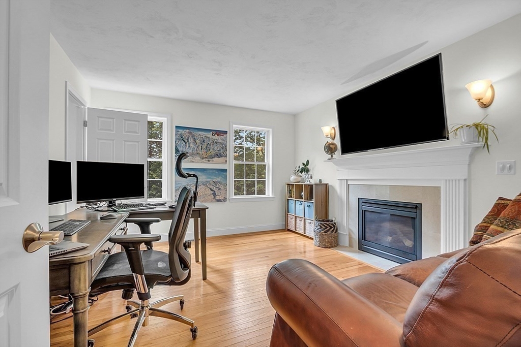 35 Willard Road Westminster, MA 01473 - Photo 13 of 36 a living room with furniture a flat screen tv and a fireplace