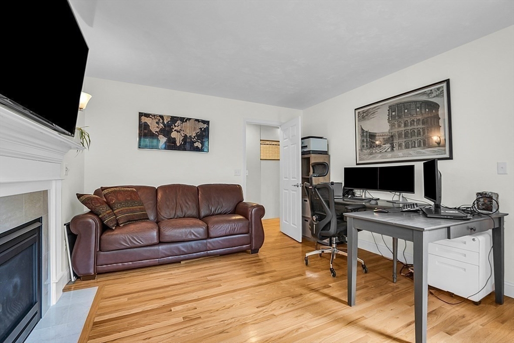 35 Willard Road Westminster, MA 01473 - Photo 14 of 36 a living room with furniture a flat screen tv and a fireplace