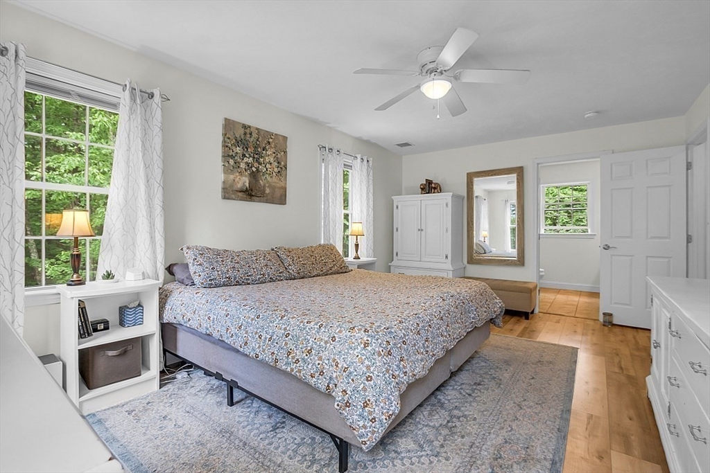 35 Willard Road Westminster, MA 01473 - Photo 18 of 36 a bedroom with a large bed and a chandelier