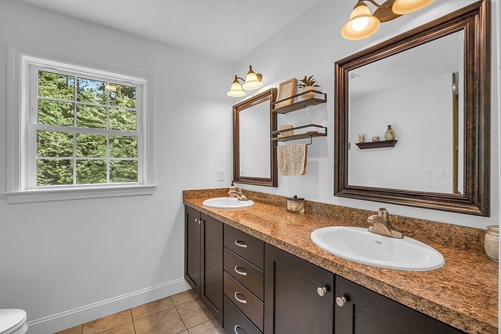 35 Willard Road Westminster, MA 01473 - Photo 19 of 36 a bathroom with a granite countertop sink a mirror and a window
