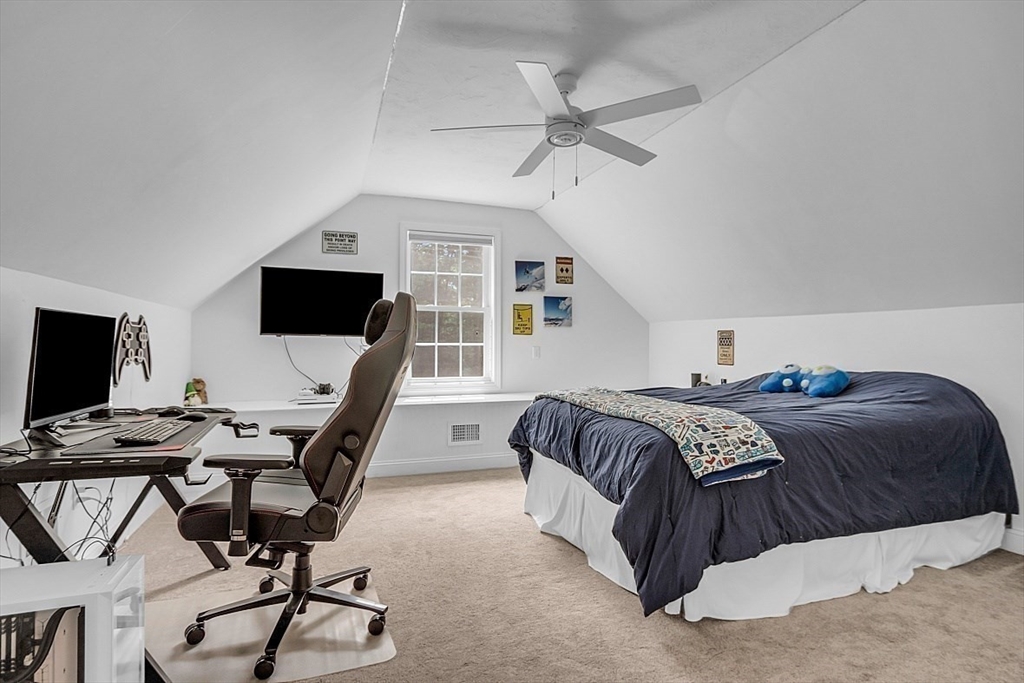 35 Willard Road Westminster, MA 01473 - Photo 24 of 36 a bedroom with a large bed and a flat screen tv