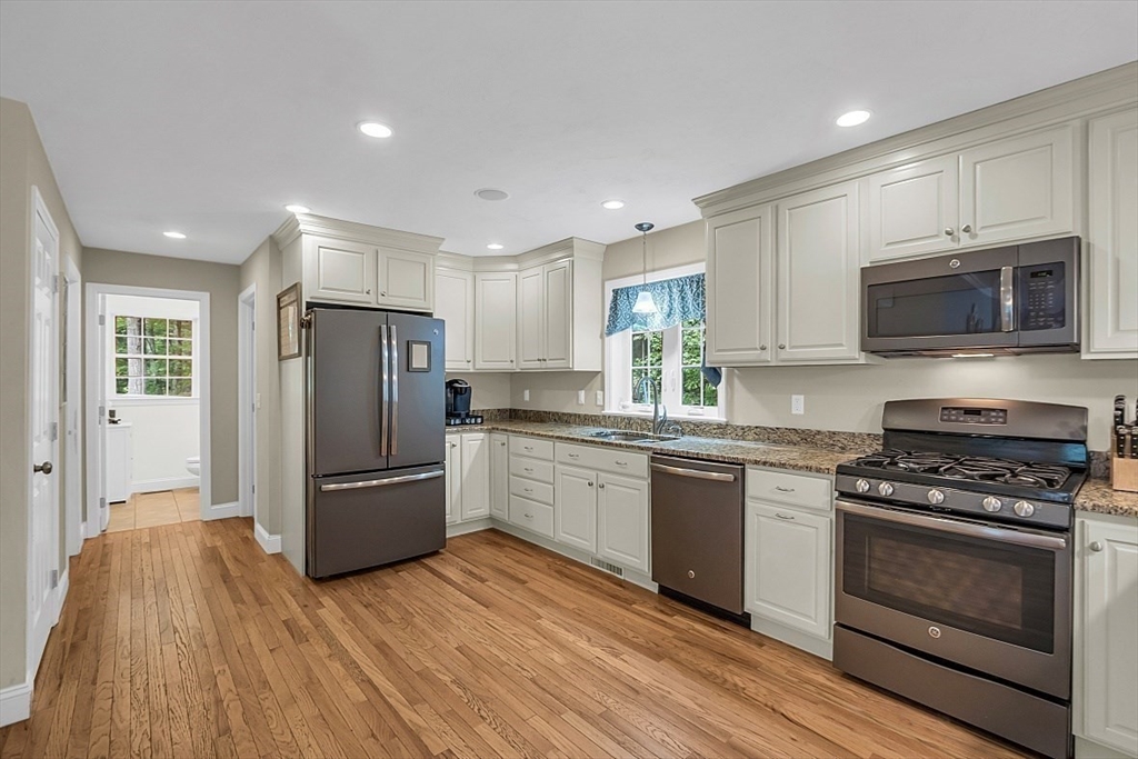 35 Willard Road Westminster, MA 01473 - Photo 9 of 36 a kitchen with granite countertop a refrigerator and a stove top oven