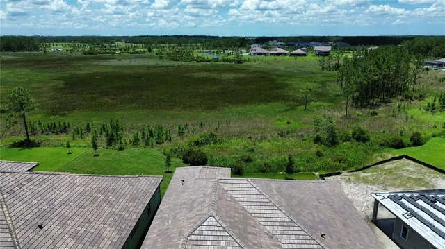 a backyard of a house with lots of green space