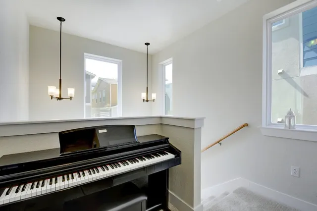 a open kitchen with stove a sink and a window