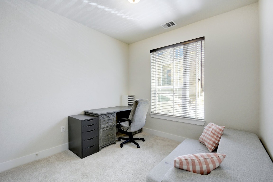 2012 Cleese Drive, Unit 182C Austin, TX 78741 - Photo 21 of 24 a view of workspace with a couch