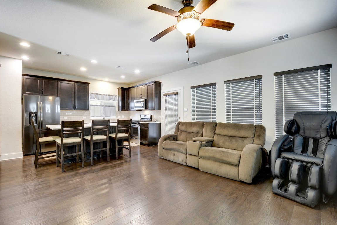 2012 Cleese Drive, Unit 182C Austin, TX 78741 - Photo 6 of 24 a living room with furniture kitchen view and a wooden floor