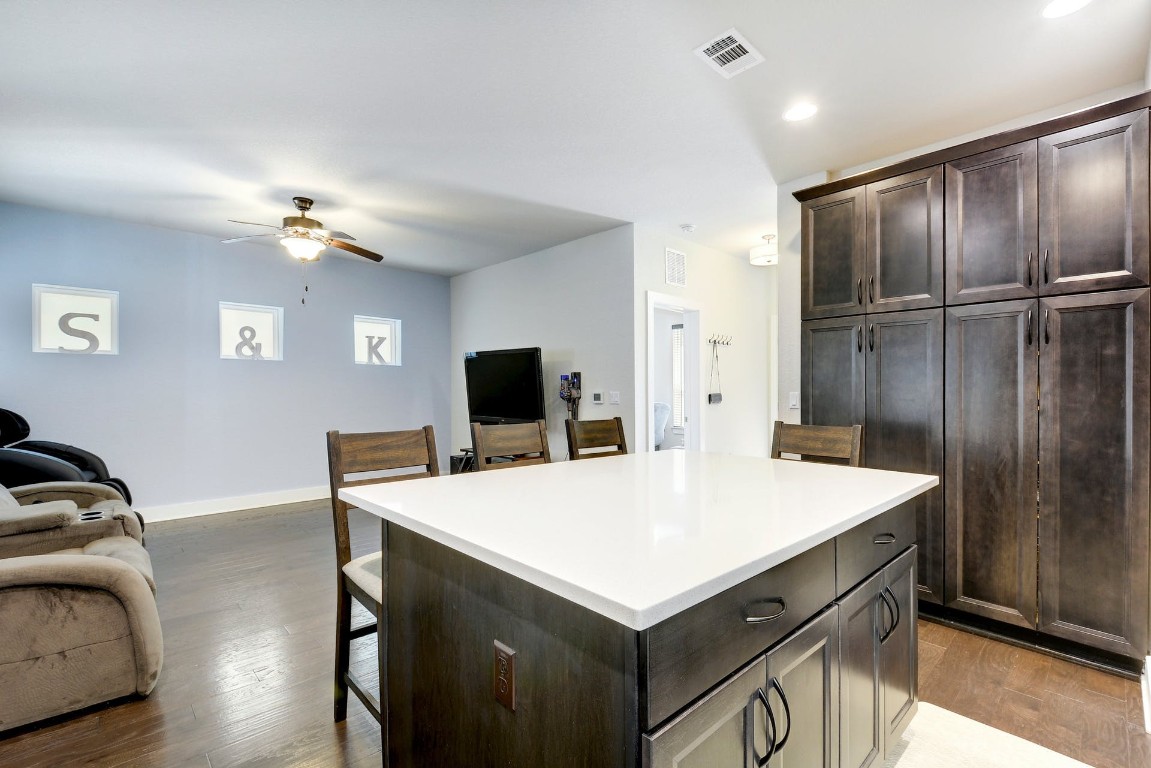2012 Cleese Drive, Unit 182C Austin, TX 78741 - Photo 10 of 24 a room with a table and a refrigerator