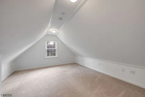 an empty room with a empty space and windows