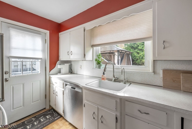431 Goffle Road Wyckoff, NJ 07481 - Photo 6 of 20 a kitchen with stainless steel appliances a sink stove and window