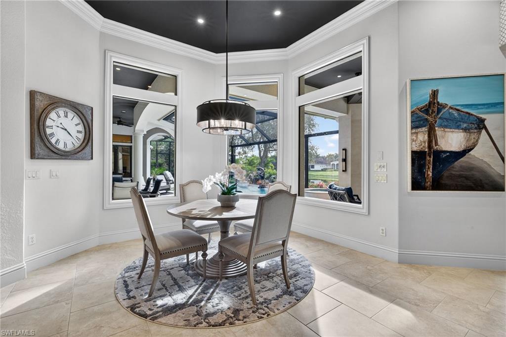 16488 Felicita Court Naples, FL 34110 - Photo 12 of 50 a dining room with furniture and window