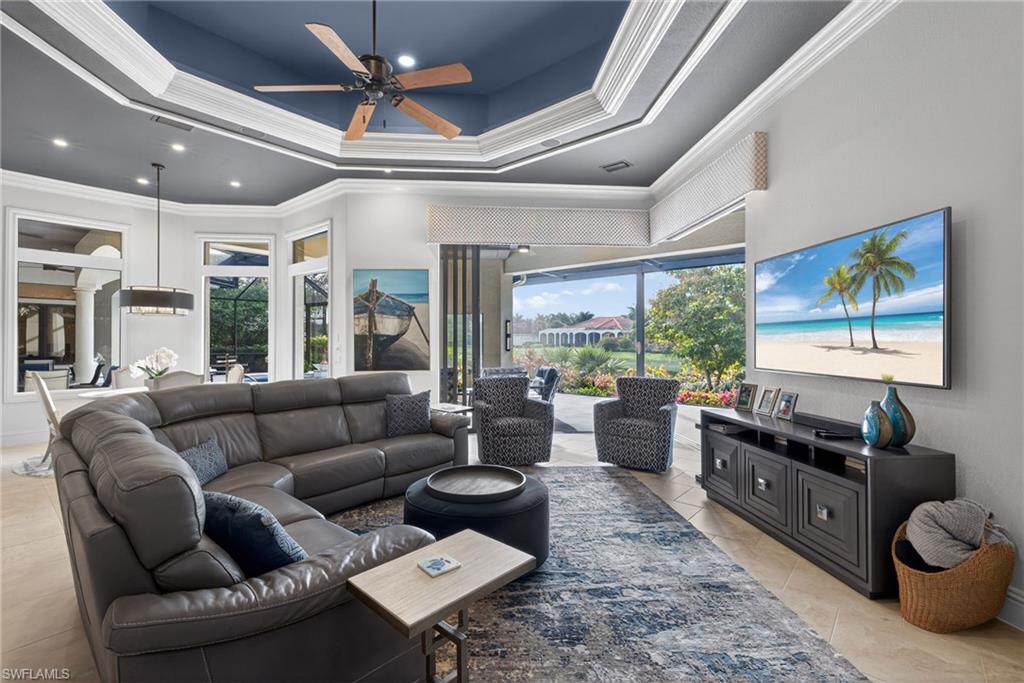 16488 Felicita Court Naples, FL 34110 - Photo 14 of 50 a living room with furniture and a large window